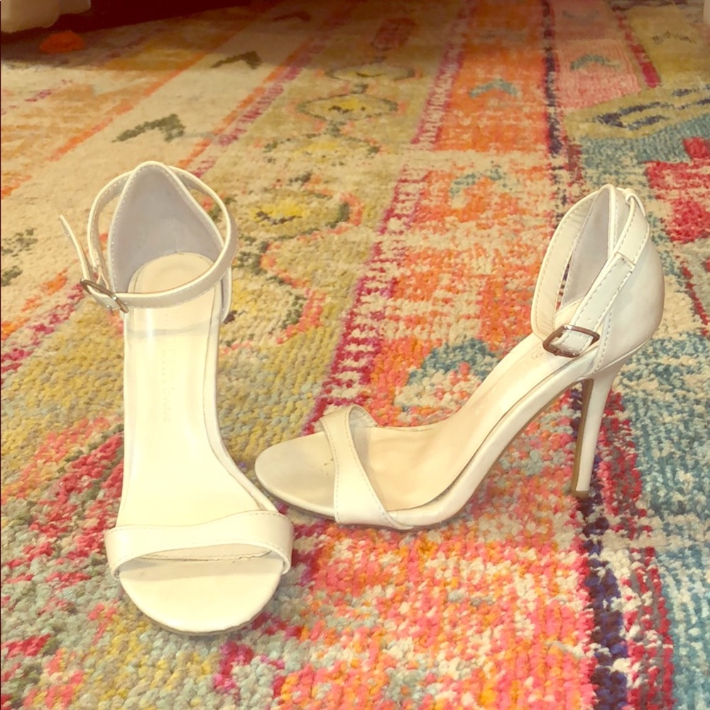 Cream spike heels with buckle ankle straps